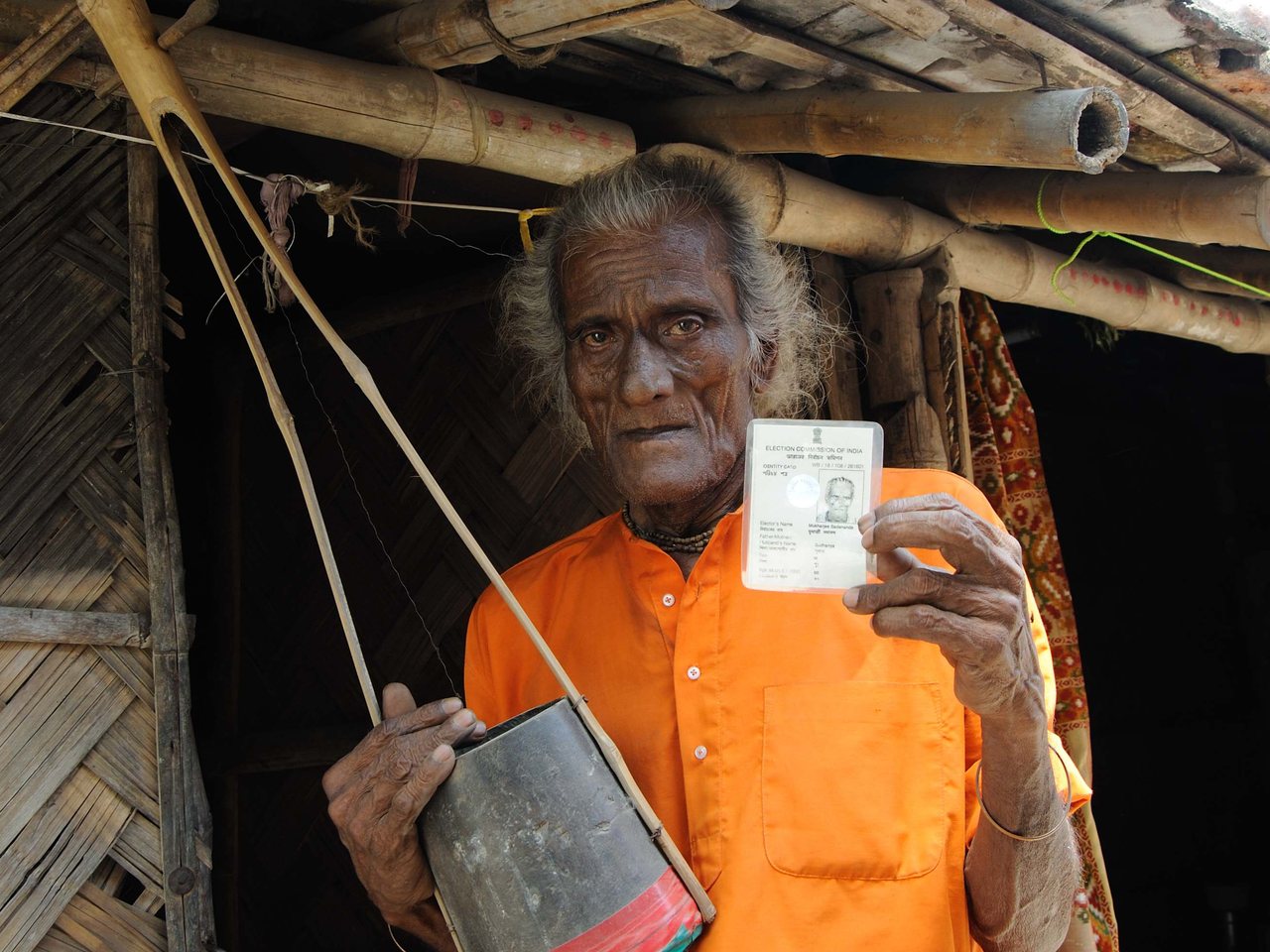 A voter holding an election identity card (file photo)